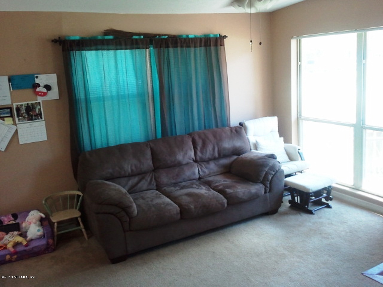 2133 Newberry Road Jacksonville, FL 32218 - Photo 16 of 29 a living room with furniture and a window