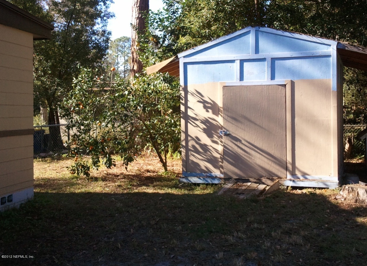 2133 Newberry Road Jacksonville, FL 32218 - Photo 20 of 29 a view of a house with a yard