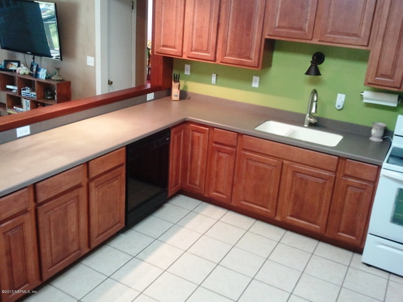 2133 Newberry Road Jacksonville, FL 32218 - Photo 3 of 29 a kitchen with a sink cabinets and utility