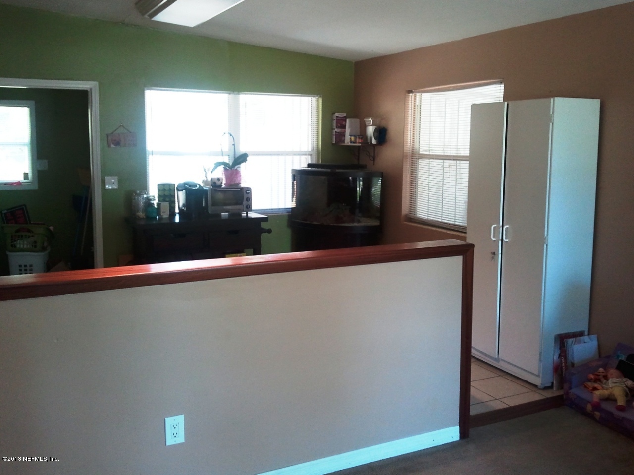 2133 Newberry Road Jacksonville, FL 32218 - Photo 5 of 29 a close view of dining table chair and natural light