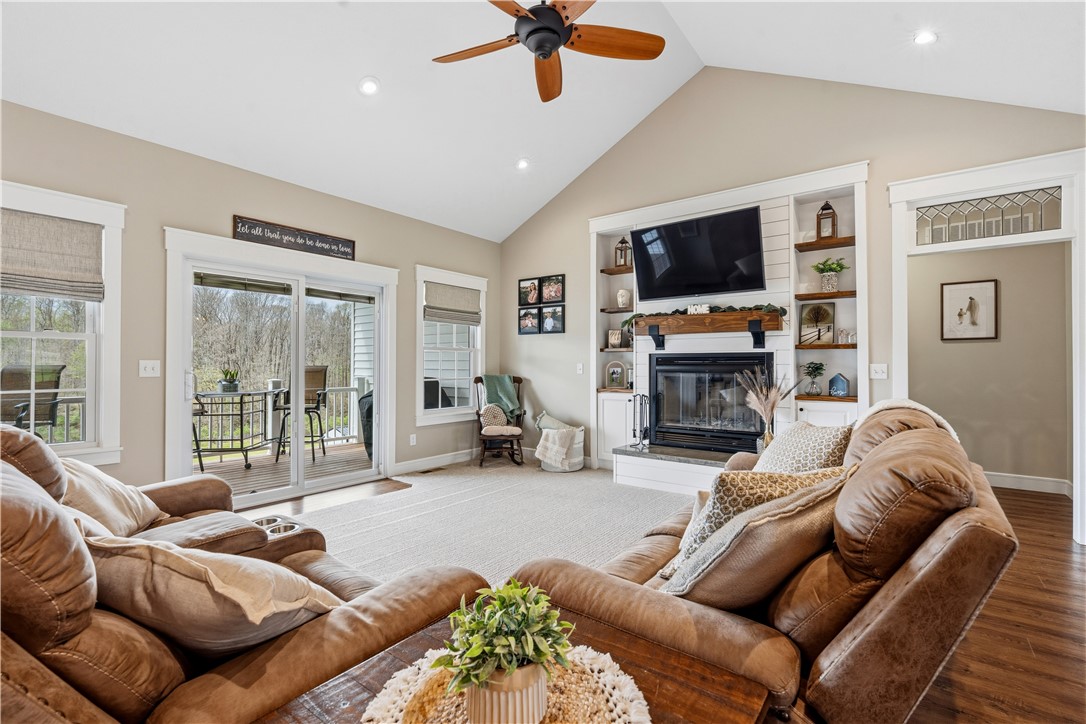 1158 Pyle Road Clarksville, OH 45113 - Photo 18 of 76 This inviting living area features a fireplace and outdoor access for relaxed gatherings.
