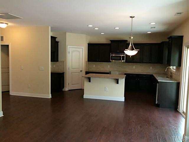 7537 Channery Way, Unit LT39 Raleigh, NC 27616 - Photo 6 of 16 Open kitchen with Birch Twighlight cabinets, granite, and SS appliances.