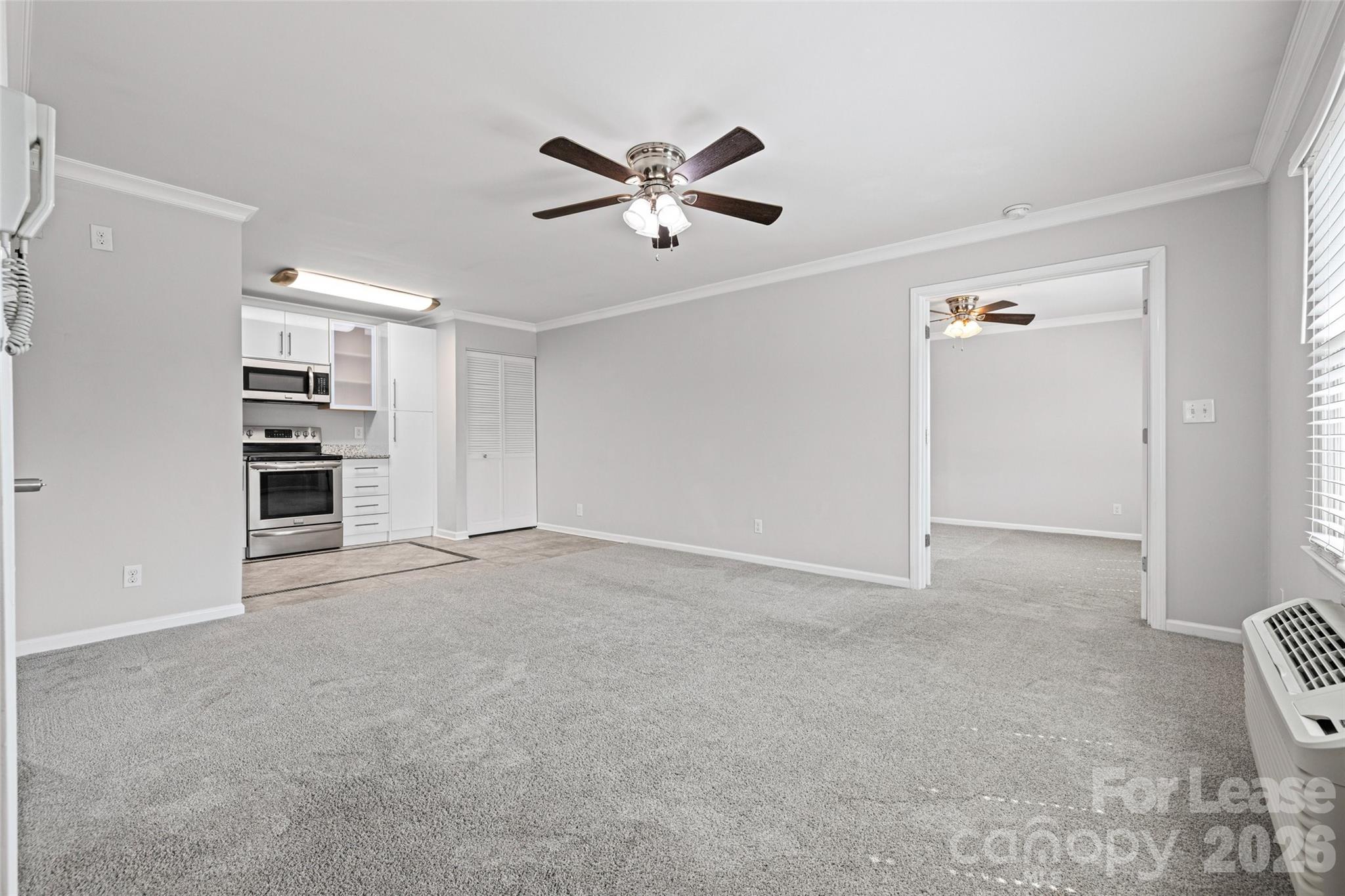 113 Stroupe Road, Unit E Gastonia, NC 28056 - Photo 8 of 33 a view of an empty room with a window