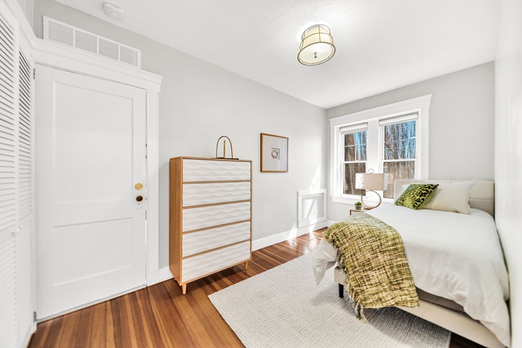 50 Lancaster Terrace, Unit 4 Brookline, MA 02446 - Photo 12 of 20 a bedroom with a bed and a window