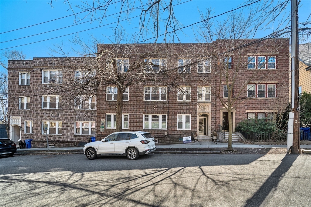 50 Lancaster Terrace, Unit 4 Brookline, MA 02446 - Photo 17 of 20 a building with multiple cars parked in front of it