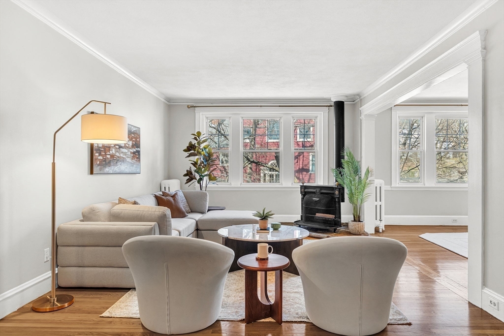 50 Lancaster Terrace, Unit 4 Brookline, MA 02446 - Photo 2 of 20 a living room with furniture a large window and a flat screen tv
