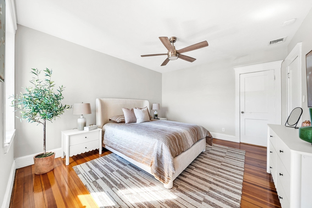 50 Lancaster Terrace, Unit 4 Brookline, MA 02446 - Photo 8 of 20 a bedroom with bed and a potted plant