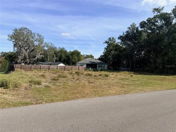 a view of swimming pool with an outdoor seating