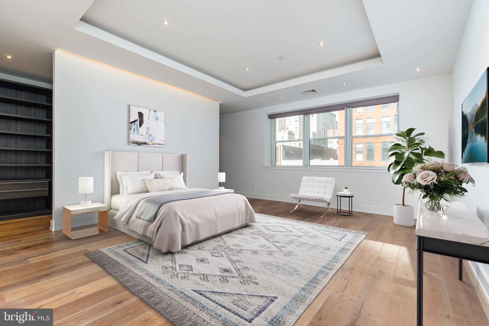 725 Chestnut Street, Unit 2 Philadelphia, PA 19106 - Photo 17 of 29 a bedroom with a large bed and a potted plant