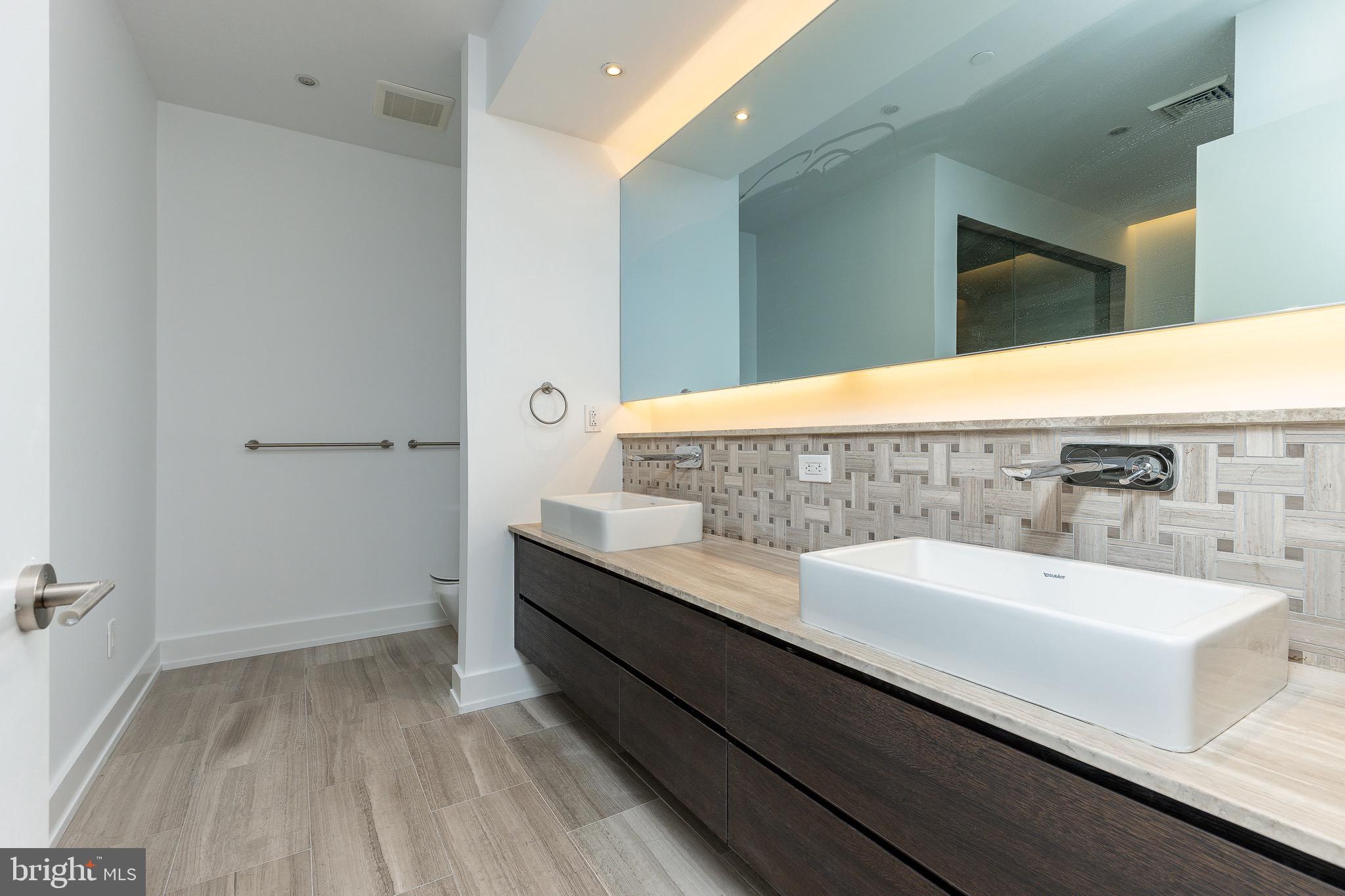725 Chestnut Street, Unit 2 Philadelphia, PA 19106 - Photo 18 of 29 a bathroom with a sink and a mirror