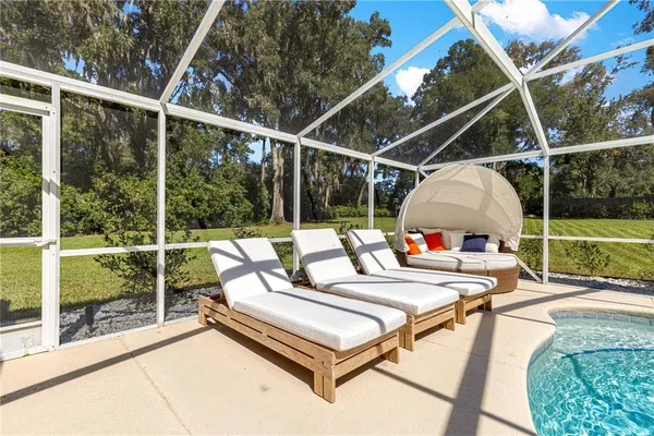 a view of a chairs and table in the roof deck