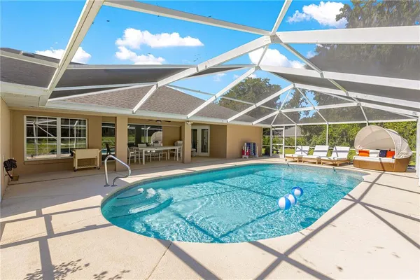 a view of a swimming pool with a patio