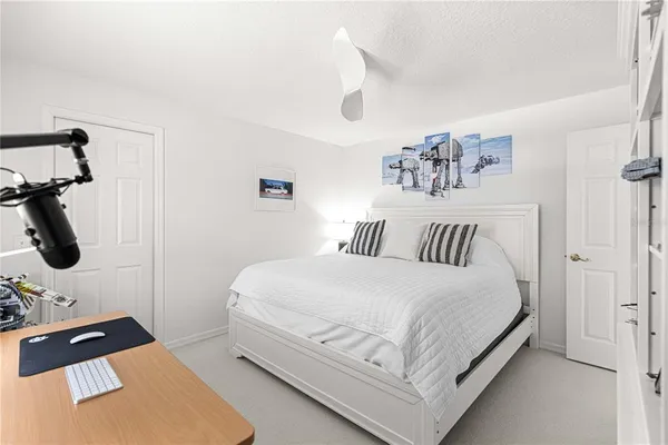 a bedroom with a bed and walk in closet