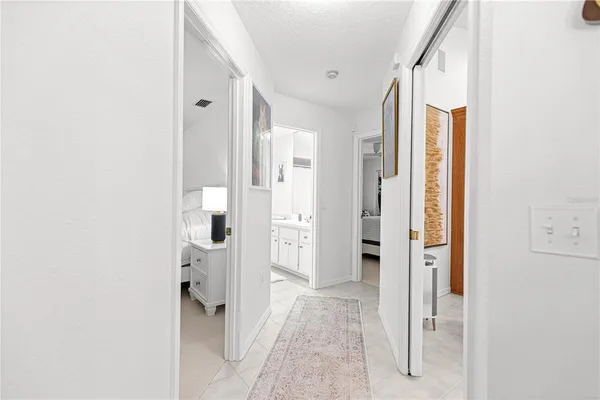 a spacious bedroom with a bed and a couch