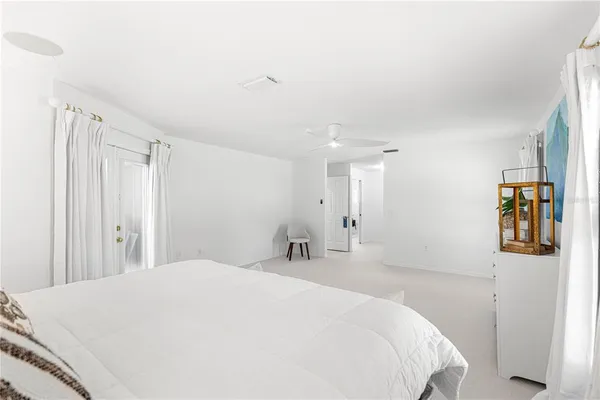 a spacious bathroom with a double vanity sink mirror and bathtub