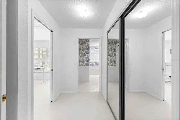 a view of a house with swimming pool and sitting area