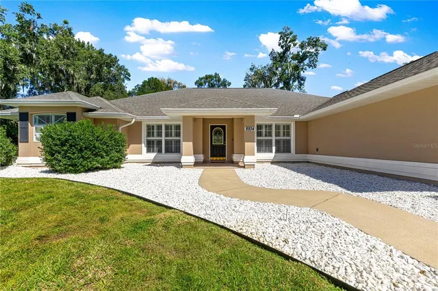 a view of a house with a yard