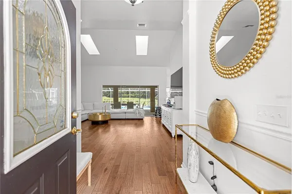 a view of living room with furniture and a wooden floor