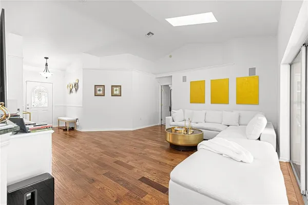 a living room with dining table and a couch