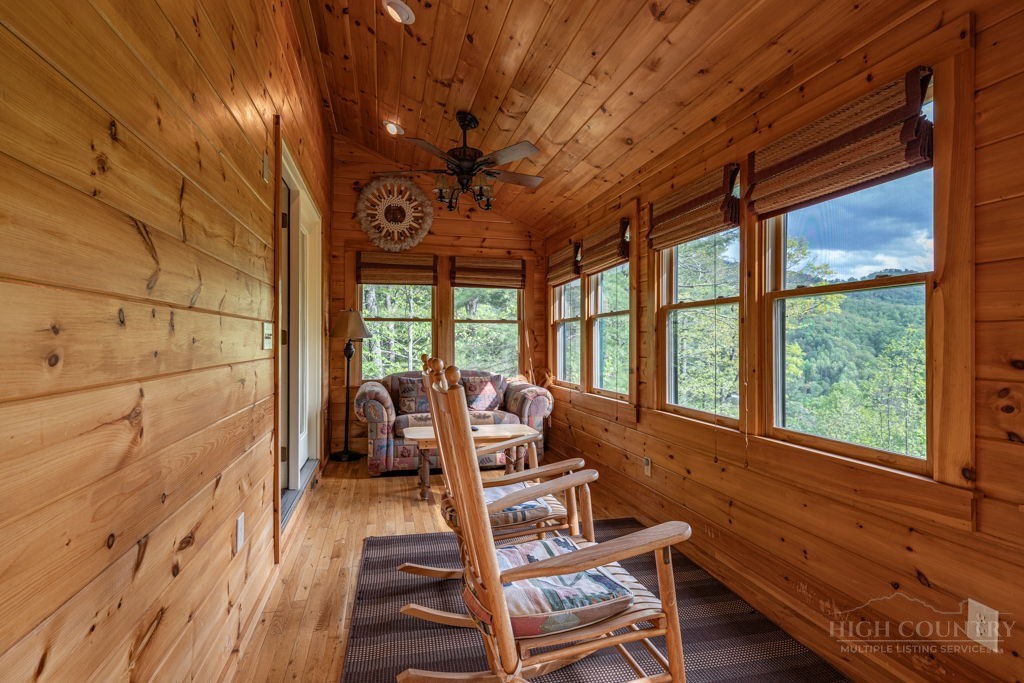 197 Woodby Ridge Road Vilas, NC 28692 - Photo 12 of 45 a room with wooden floor pool table and chairs