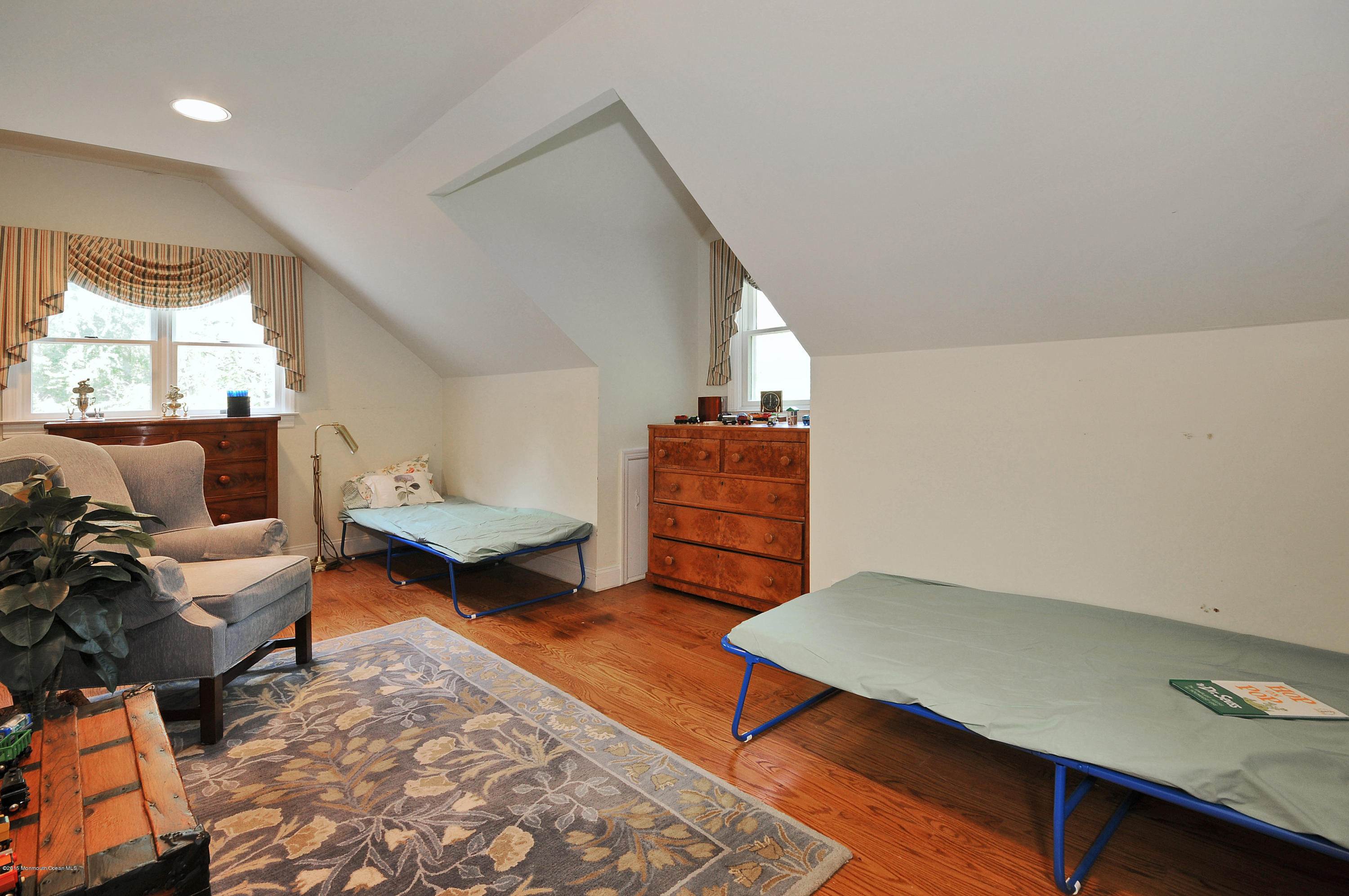 57 Heyers Mill Road Colts Neck, NJ 07722 - Photo 12 of 35 a living room with furniture and a window