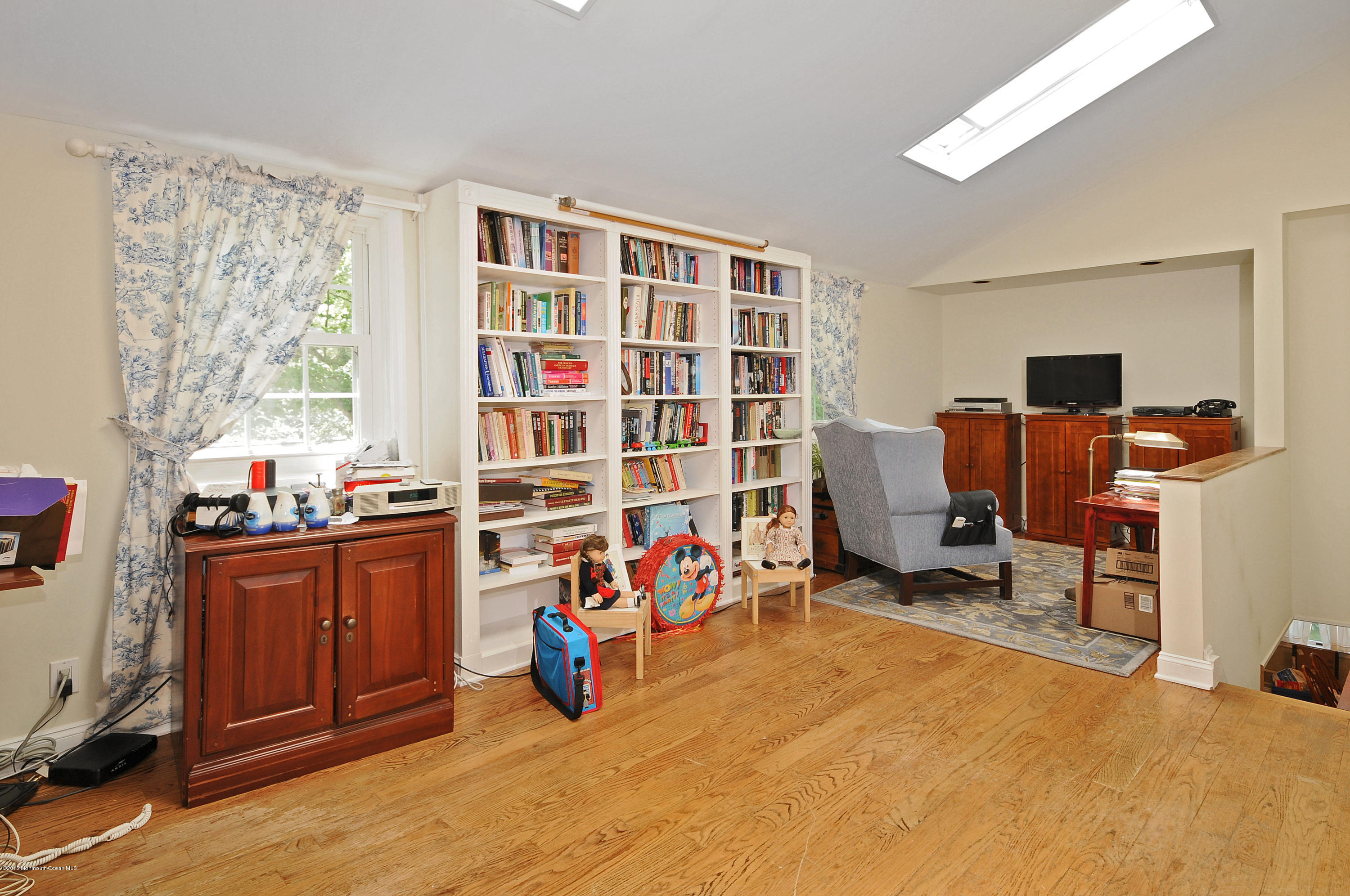 57 Heyers Mill Road Colts Neck, NJ 07722 - Photo 14 of 35 a view of a workspace with furniture and a window