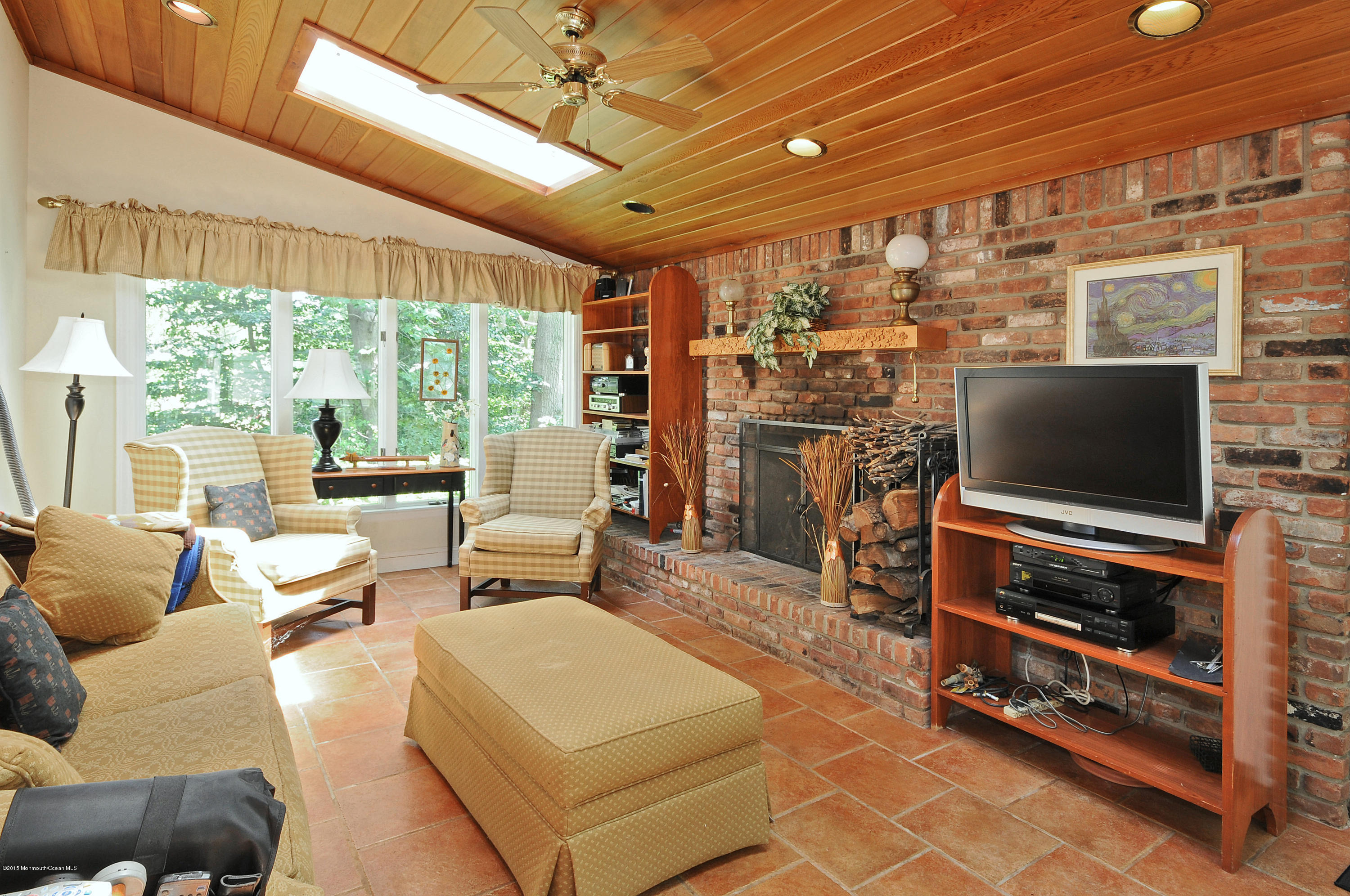 57 Heyers Mill Road Colts Neck, NJ 07722 - Photo 16 of 35 a living room with furniture and a flat screen tv