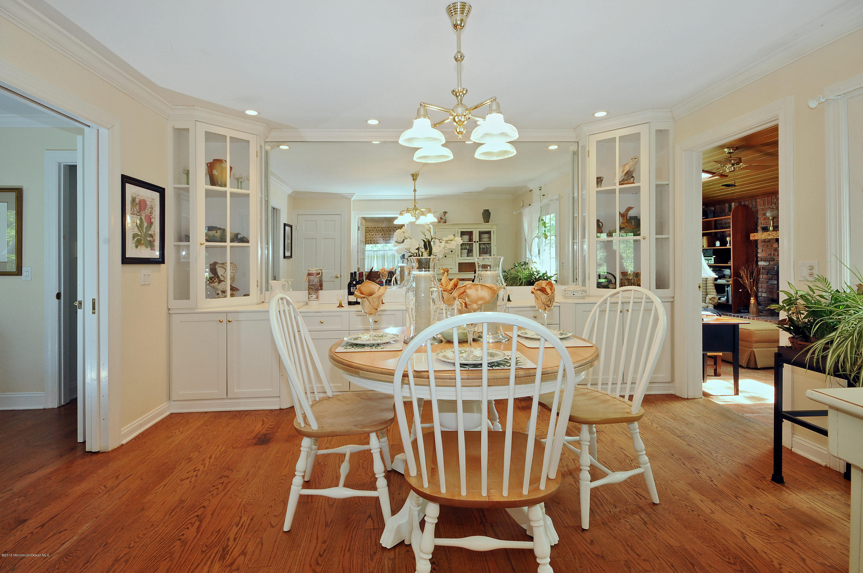 57 Heyers Mill Road Colts Neck, NJ 07722 - Photo 20 of 35 a view of a dining room with furniture wooden floor and chandelier