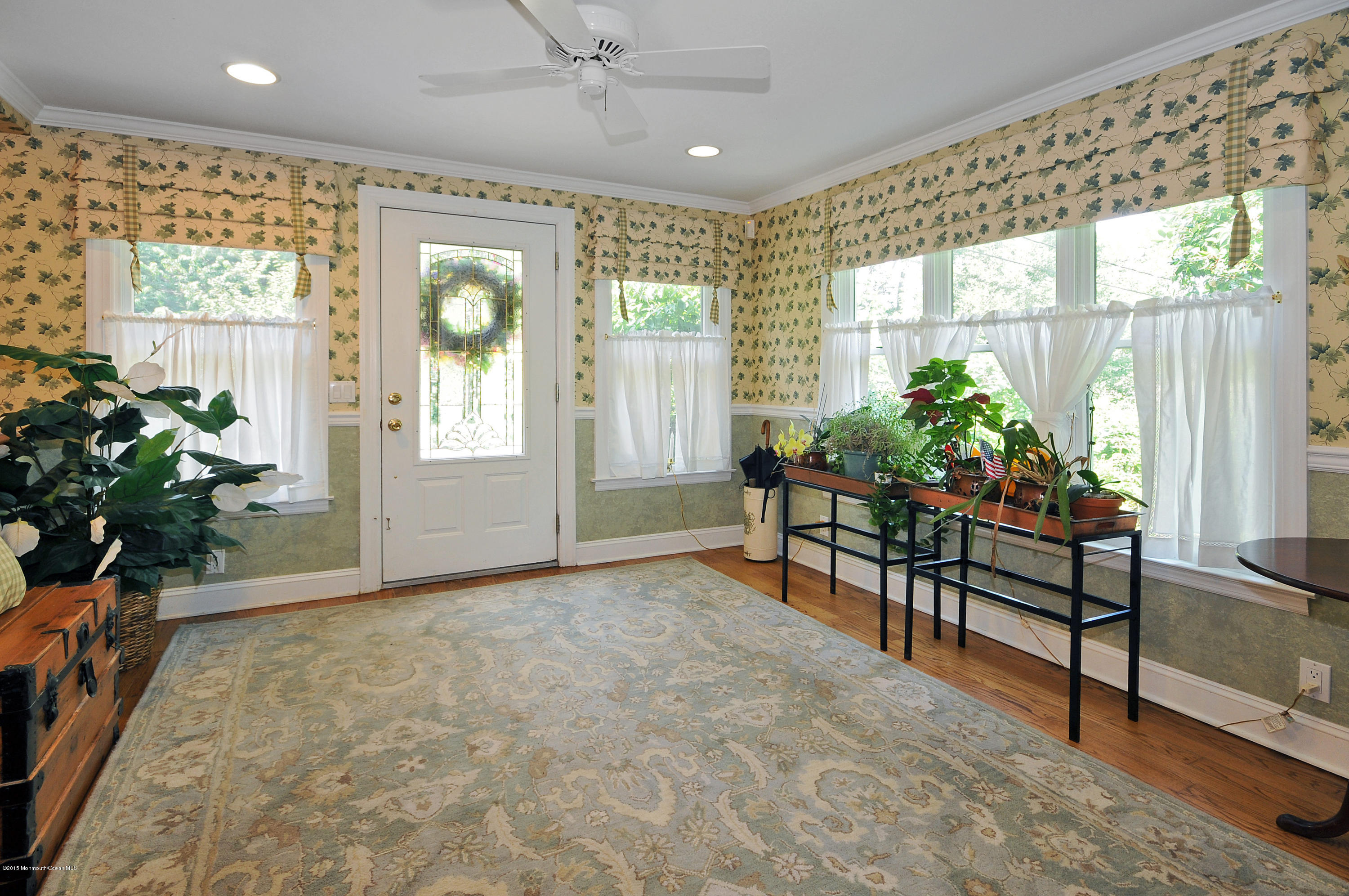 57 Heyers Mill Road Colts Neck, NJ 07722 - Photo 23 of 35 a living room with furniture and a potted plant