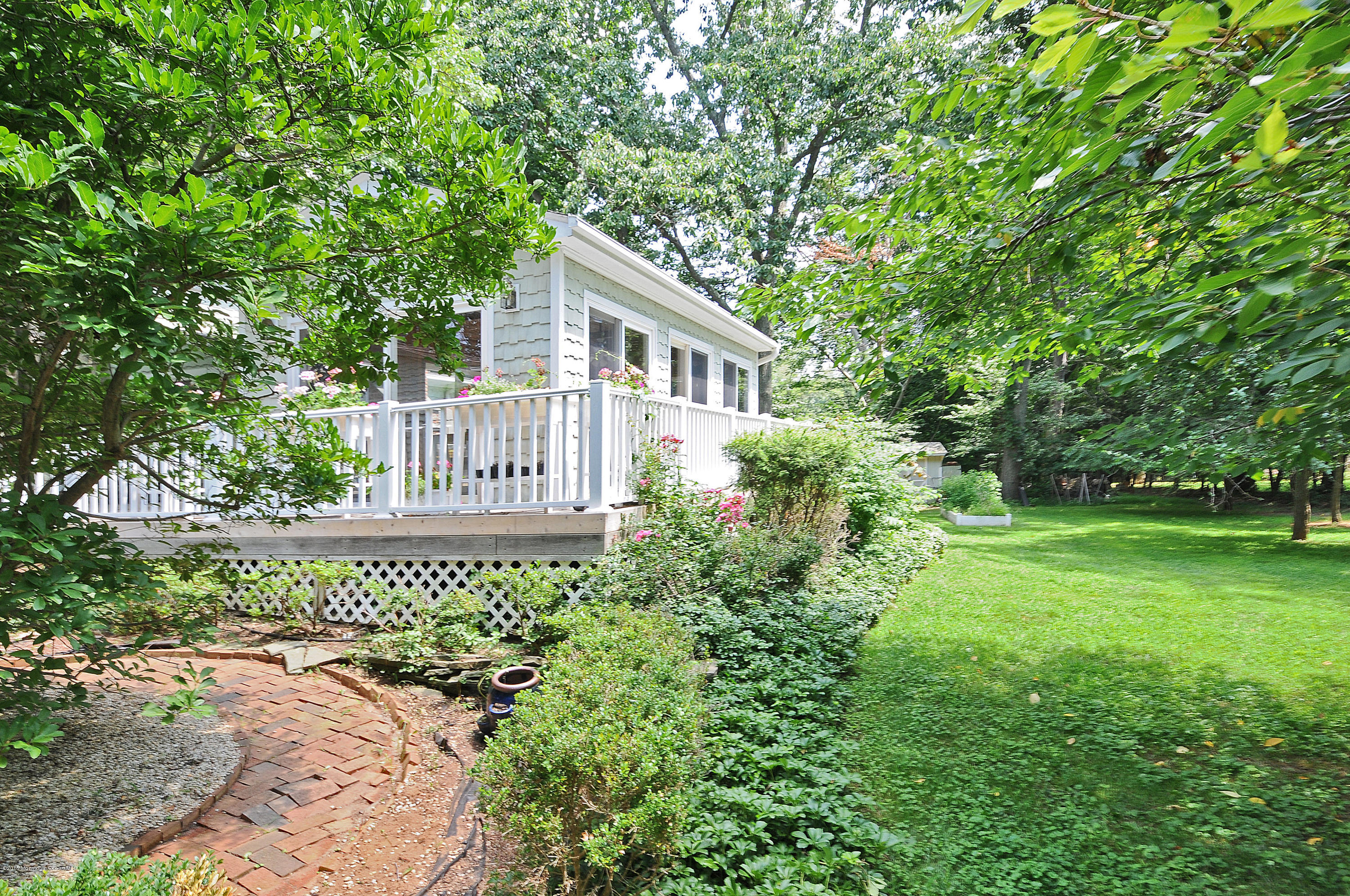 57 Heyers Mill Road Colts Neck, NJ 07722 - Photo 5 of 35 a view of a house with a yard