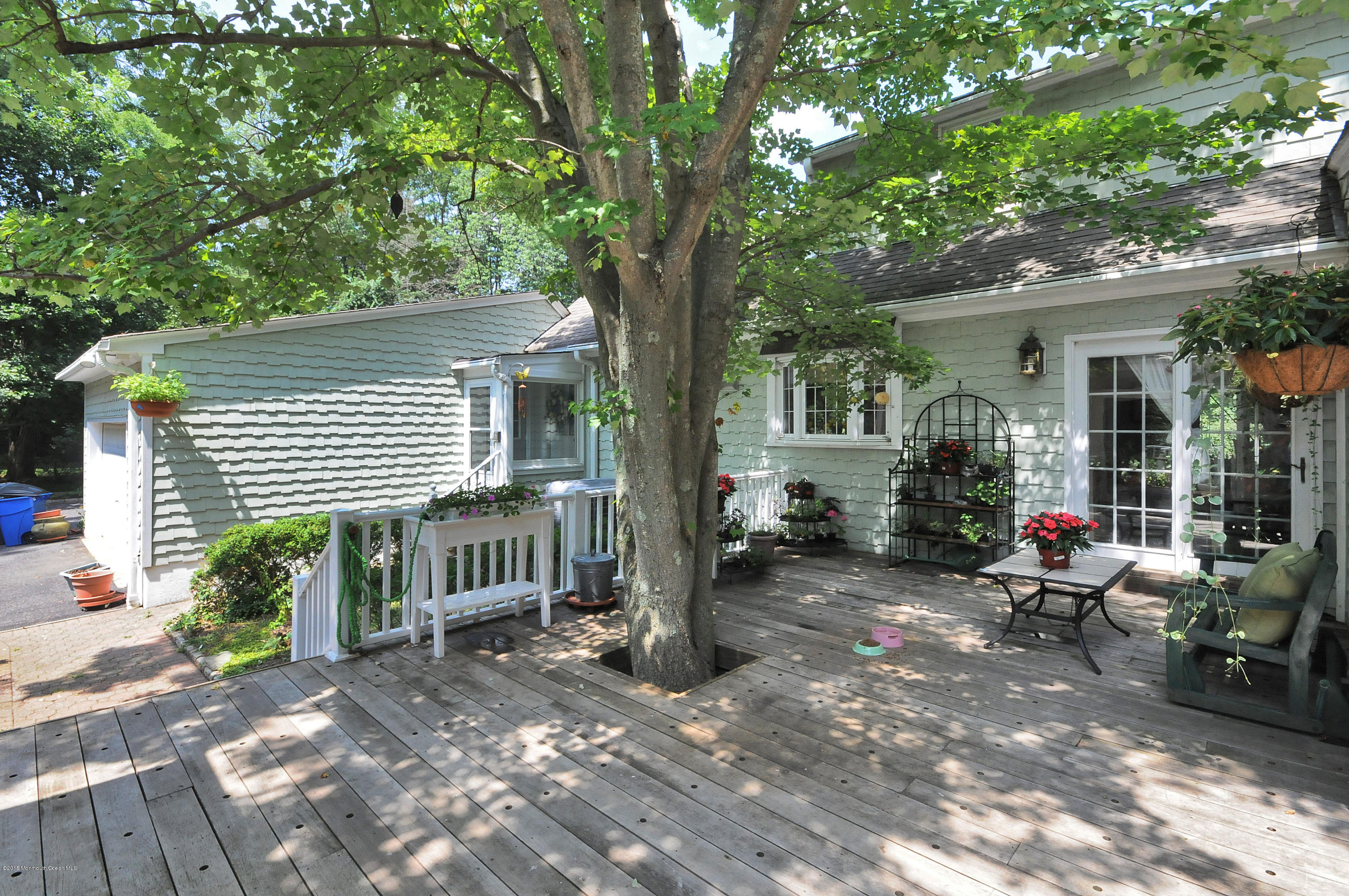 57 Heyers Mill Road Colts Neck, NJ 07722 - Photo 8 of 35 a view of a house with backyard and sitting area