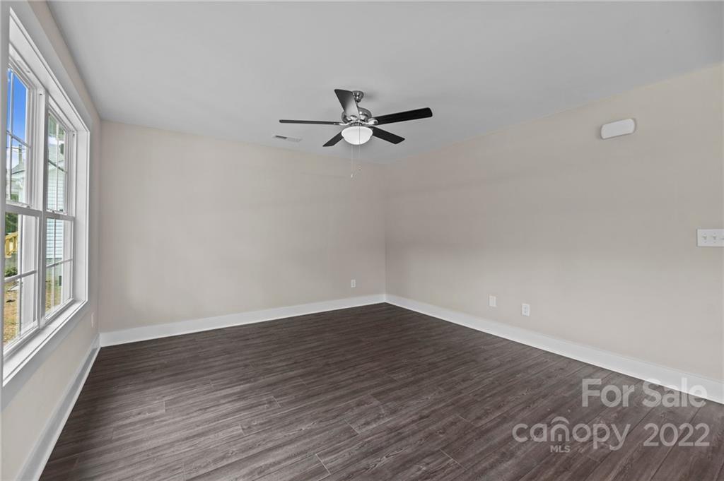 955 Pine Ridge Road, Unit 5 Chester, SC 29706 - Photo 11 of 26 wooden floor in an empty room with a window