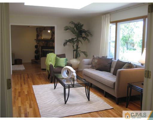 3 Fielding Place Edison, NJ 08820 - Photo 2 of 25 a living room with furniture and a wooden floor