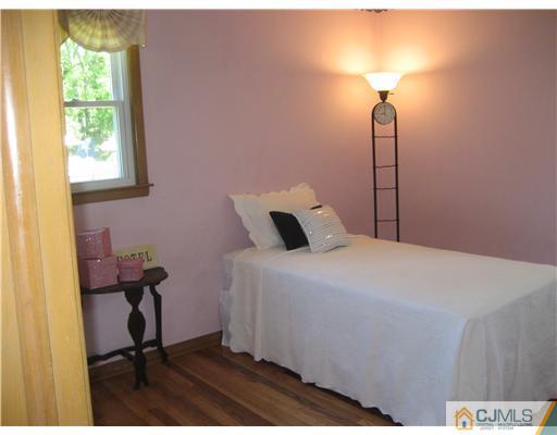 3 Fielding Place Edison, NJ 08820 - Photo 15 of 25 a bedroom with a bed and a window
