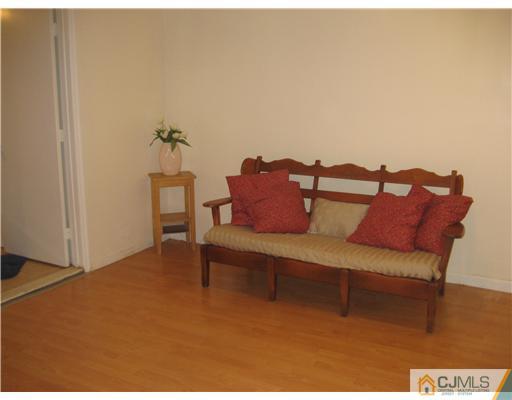 3 Fielding Place Edison, NJ 08820 - Photo 20 of 25 a view of a bedroom with furniture and wooden floor