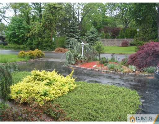 3 Fielding Place Edison, NJ 08820 - Photo 24 of 25 a backyard of a house with a yard and outdoor seating