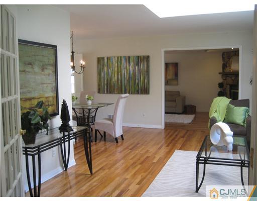 3 Fielding Place Edison, NJ 08820 - Photo 5 of 25 a living room with furniture a wooden floor and next to a window