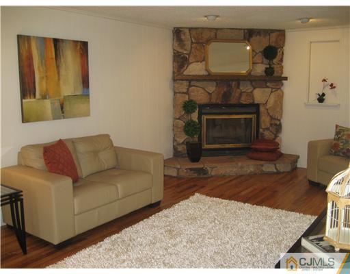 3 Fielding Place Edison, NJ 08820 - Photo 6 of 25 a living room with furniture and a fireplace