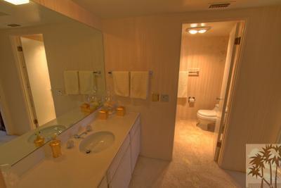 72025 Petunia Way Rancho Mirage, CA 92270 - Photo 12 of 18 a bathroom with a sink and mirror with toilet