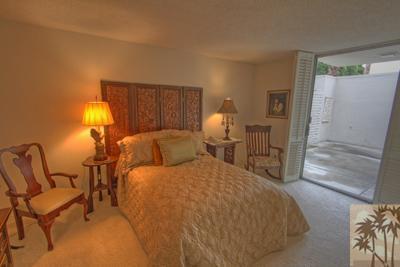 72025 Petunia Way Rancho Mirage, CA 92270 - Photo 13 of 18 a bed room with a bed and a lamp
