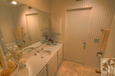 72025 Petunia Way Rancho Mirage, CA 92270 - Photo 15 of 18 a bathroom with a sink and mirror with shower
