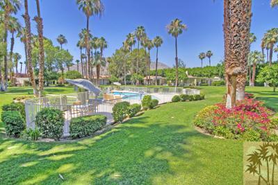 72025 Petunia Way Rancho Mirage, CA 92270 - Photo 17 of 18 a view of a garden with a building in the background