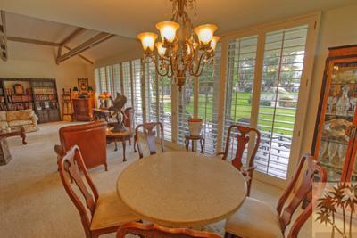72025 Petunia Way Rancho Mirage, CA 92270 - Photo 8 of 18 a view of a dining room with furniture window and outside view