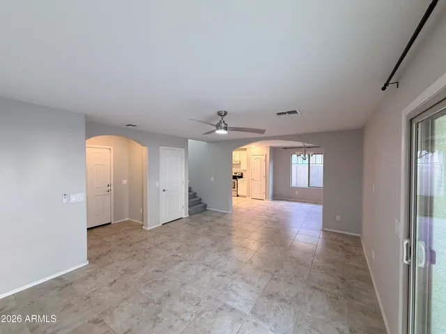a view of a kitchen with a sink a refrigerator and window