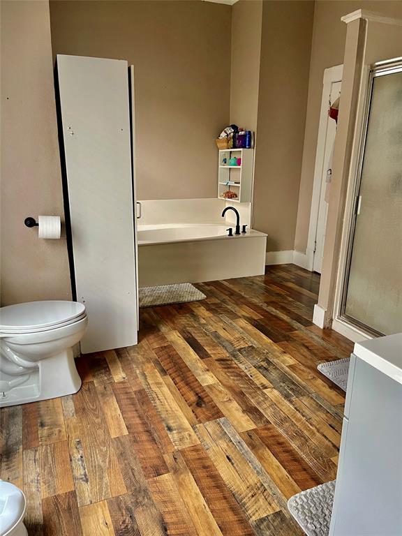 1023 North Spring Street Grand Saline, TX 75140 - Photo 11 of 39 a bathroom with a sink and a toilet