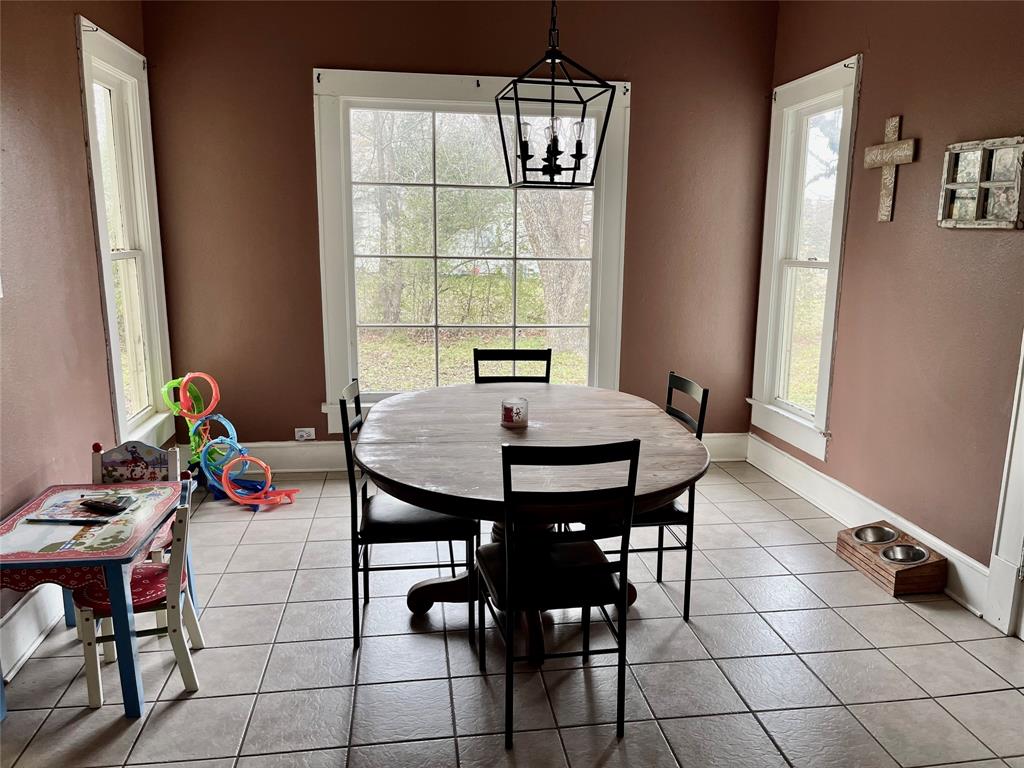 1023 North Spring Street Grand Saline, TX 75140 - Photo 14 of 39 a view of a dining room with furniture and window