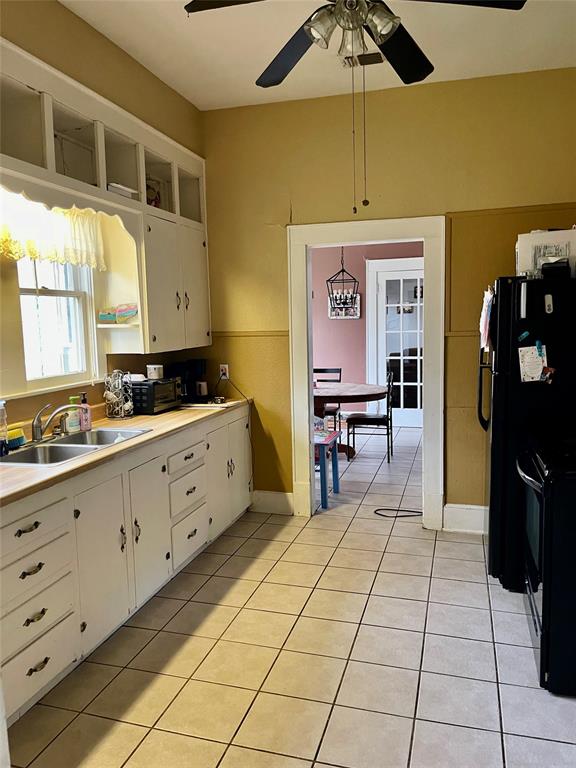 1023 North Spring Street Grand Saline, TX 75140 - Photo 15 of 39 a spacious bathroom with a sink a mirror and a shower