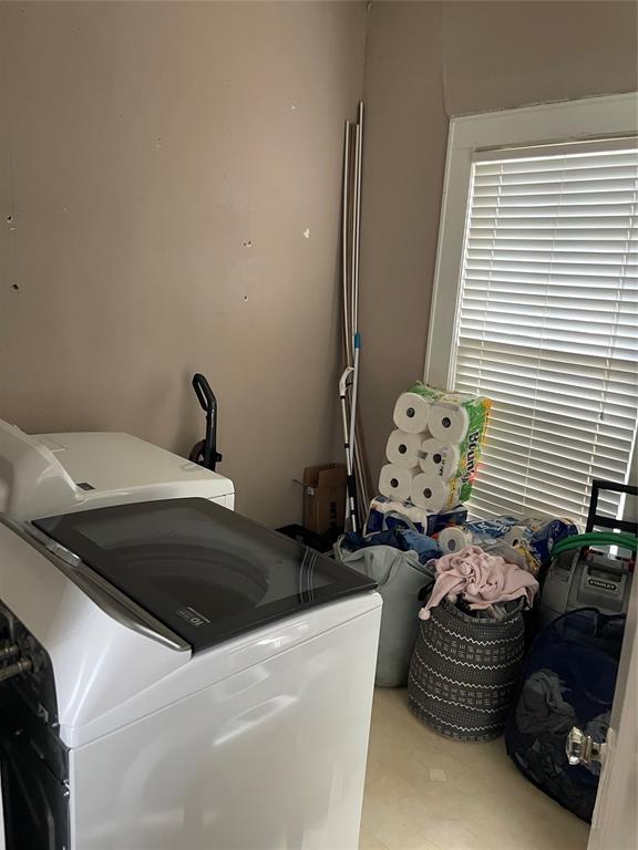 1023 North Spring Street Grand Saline, TX 75140 - Photo 16 of 39 a bedroom with a bed and a chair