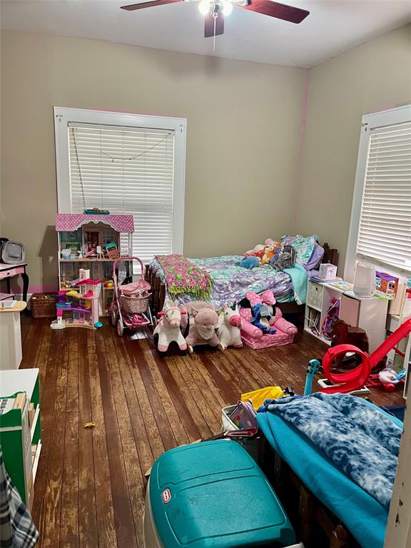 1023 North Spring Street Grand Saline, TX 75140 - Photo 17 of 39 a bed room with furniture and a window