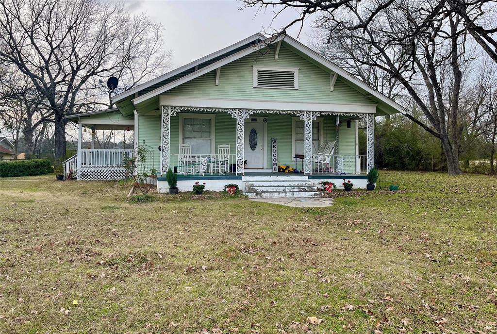 1023 North Spring Street Grand Saline, TX 75140 - Photo 19 of 39 a front view of a house with garden